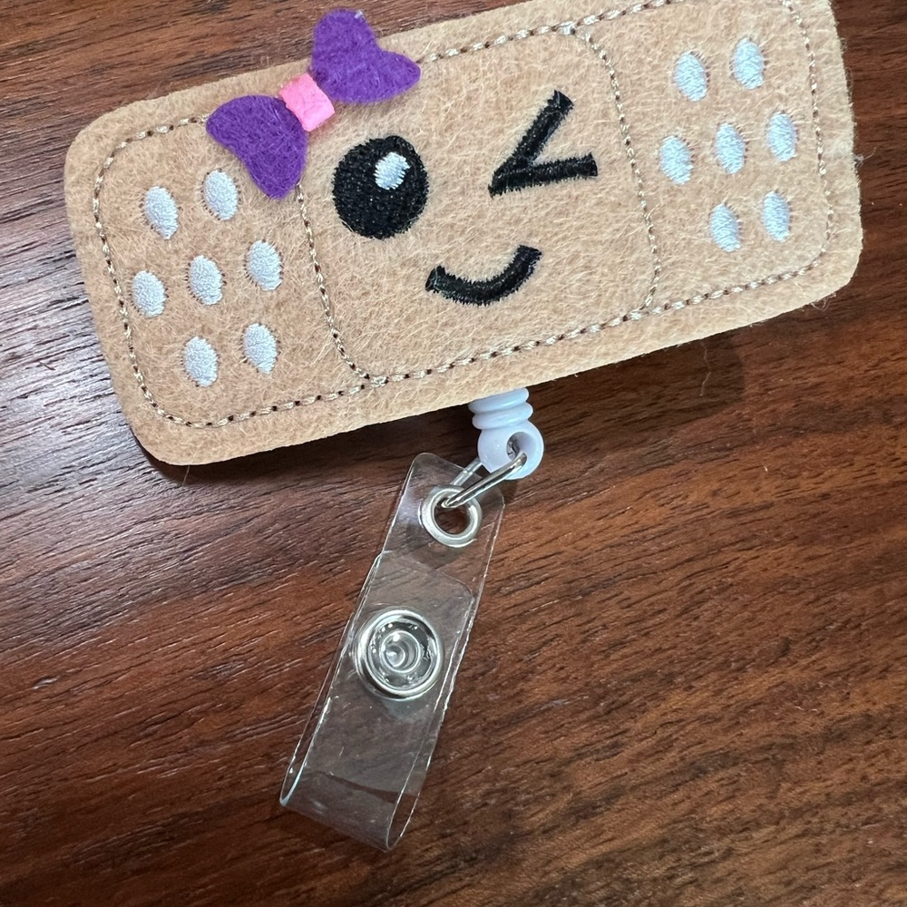 Cute Winking Bandaid Badge Holder